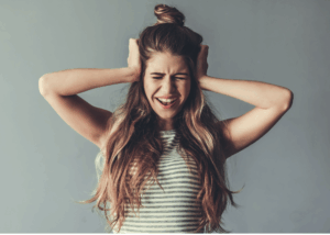 frustrated woman experiencing holiday overwhelm and overload